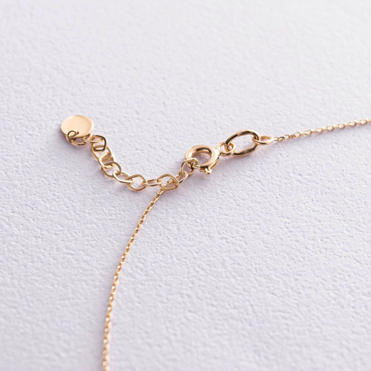 Minimalist layered gold necklace with cross and ball worn as an everyday elegant accessory-gold cross necklace-delicate double chain necklace