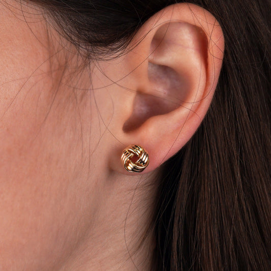Gold knot earring worn on an ear -Weight: 1 -1.1 g-for everyday wear-Knot Stud Earrings