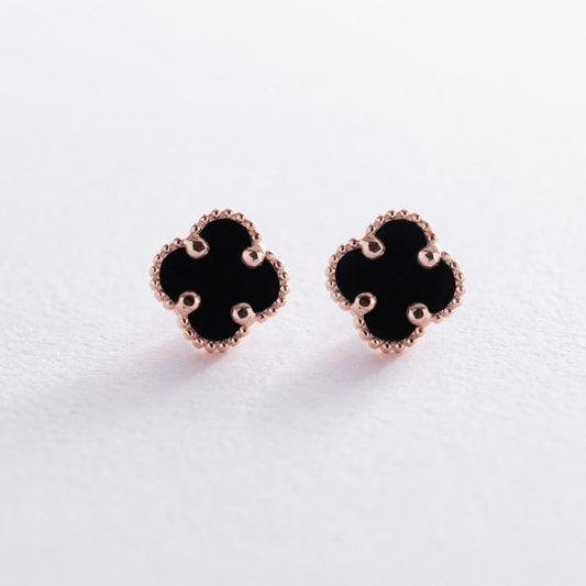 A pair of black clover-shaped stud earrings with rose gold beaded borders, displayed on a clean white surface-black onyx jewelry-minimalist gold earrings-solid gold earrings