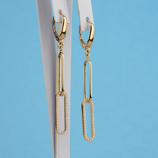 A pair of gold leverback drop earrings with elongated paperclip-shaped dangling elements, one plain gold and one set with small clear stones-link gold earrings-statement gold earrings-solid gold earrings