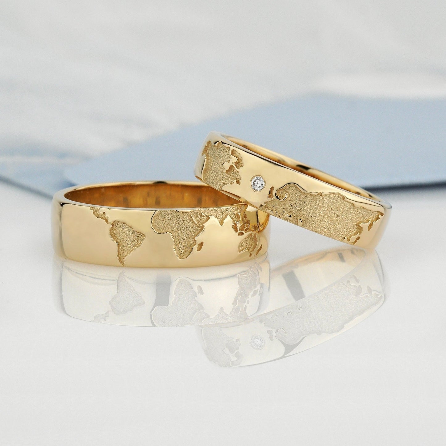 Gold wedding bands set with world map - escorialjewelry