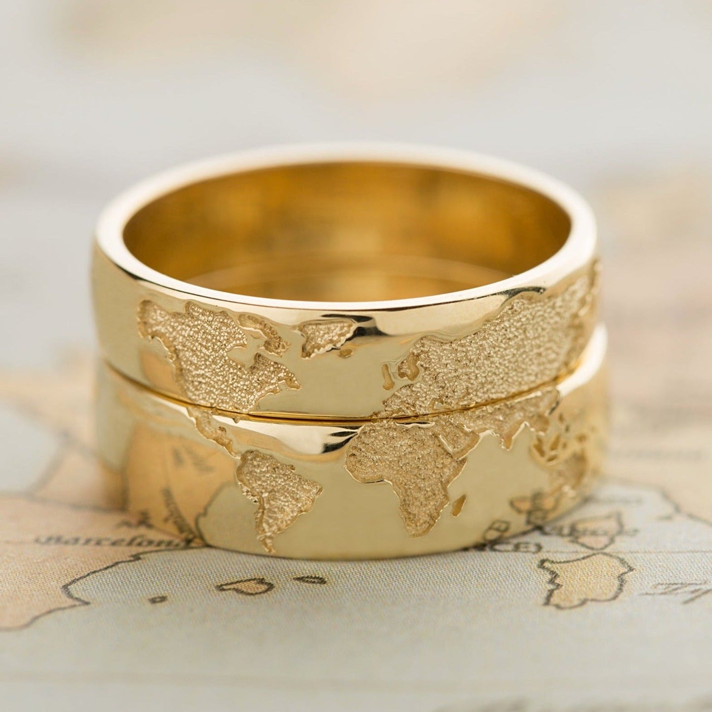 Gold wedding bands set with world map - escorialjewelry