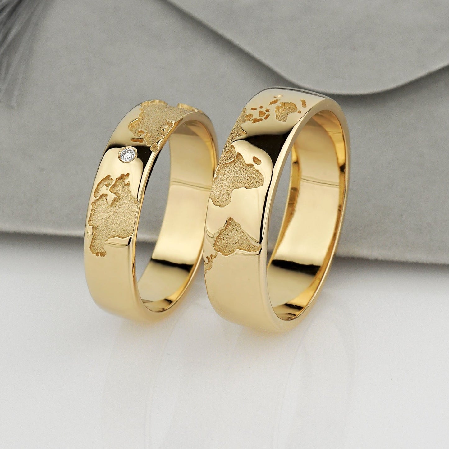 Gold wedding bands set with world map - escorialjewelry