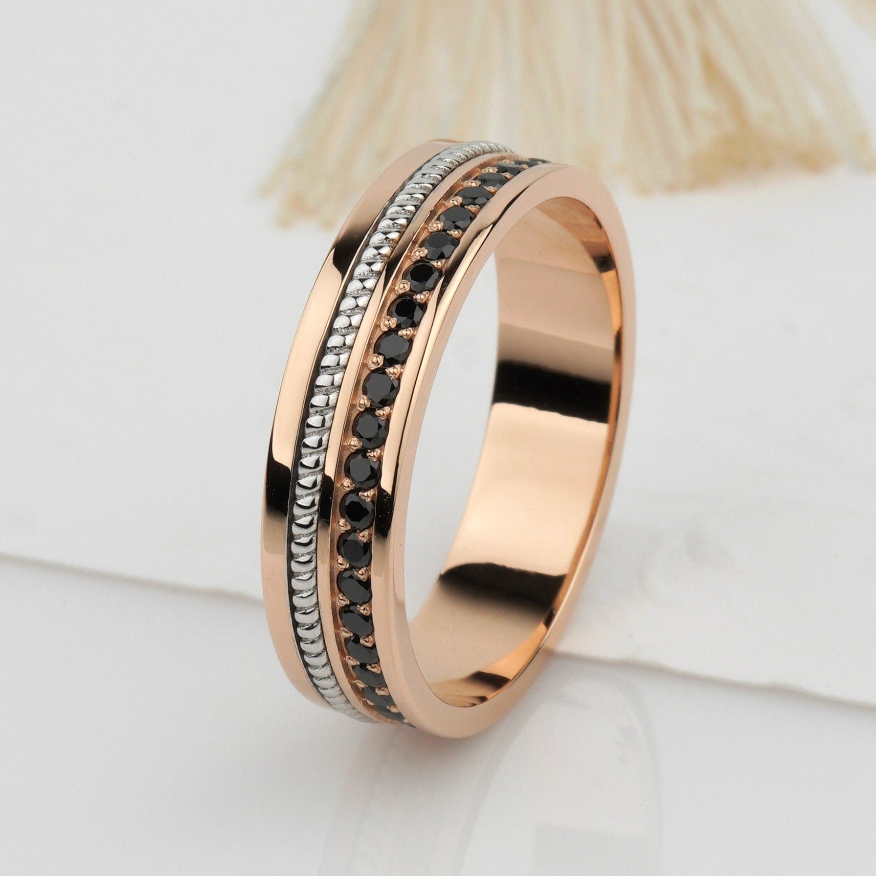 Two-tone wedding band with black diamonds