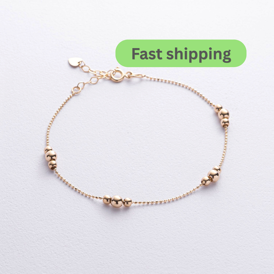 A delicate rose gold chain bracelet with small bead clusters spaced along the chain-14k gold bead bracelet-gold chain bead bracelet-solid gold bracelet women