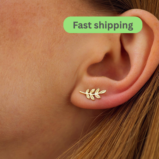 Gold leaf earring worn on an ear -Gold leaf Stud Earrings-Dainty leaves Stud Earrings