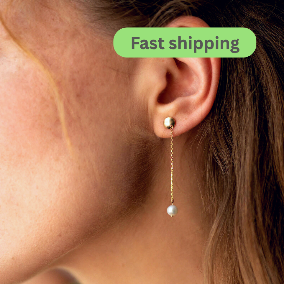 Earring worn on an ear -pearl drop earrings- Solid Gold pearl earrings