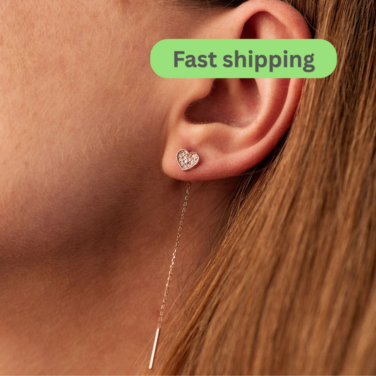 Heart-shaped earring worn by a person -Simple Everyday Gold Earrings- heart drop threader earrings