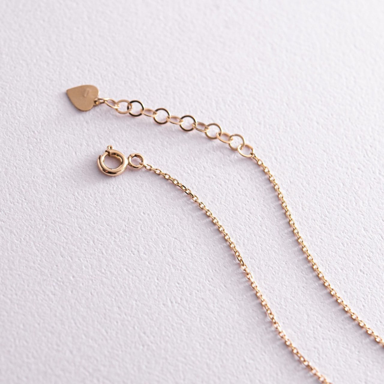 Minimalist gold cross chain necklace worn as an everyday elegant accessory-polished gold cross pendant-cross pendant necklace women