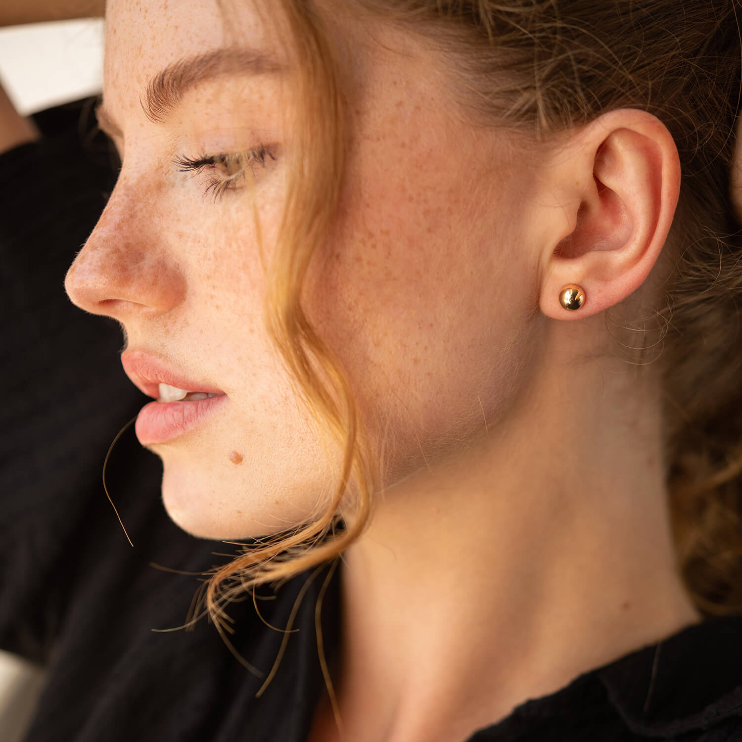 Minimalist solid gold ball studs worn as elegant everyday earrings-minimalist gold studs-7mm gold ball earrings