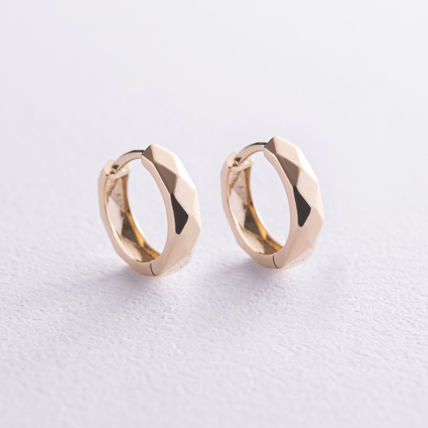 Pair of gold hoop earrings - smooth, mirror-polished surface