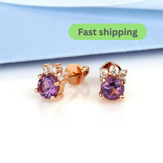 A pair of rose gold stud earrings with oval purple amethyst centers and small clear stones in a floral crown setting