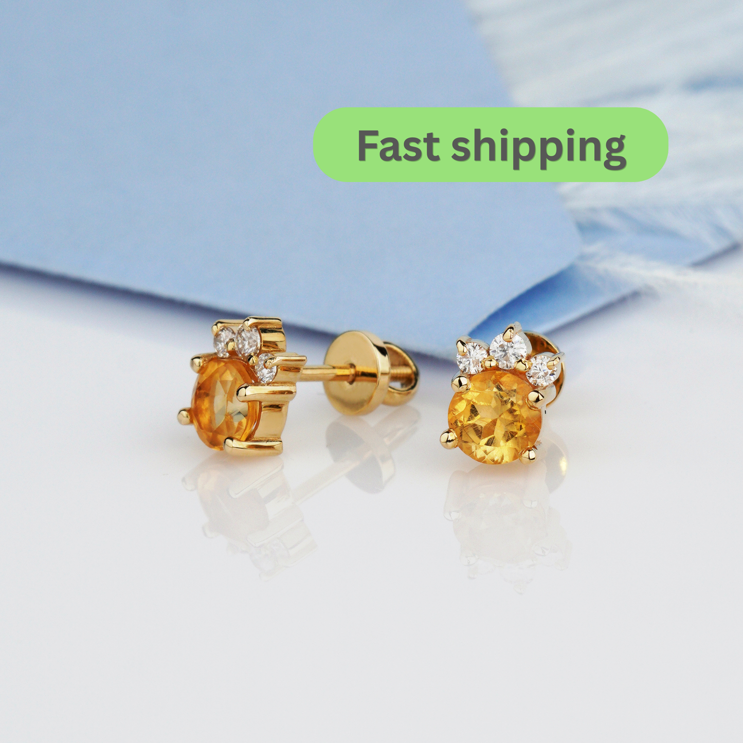 A pair of gold stud earrings with oval yellow gemstones and small clear accent stones-citrine earrings-moissanite earrings- yellow gold earrings- 14k gold earrings