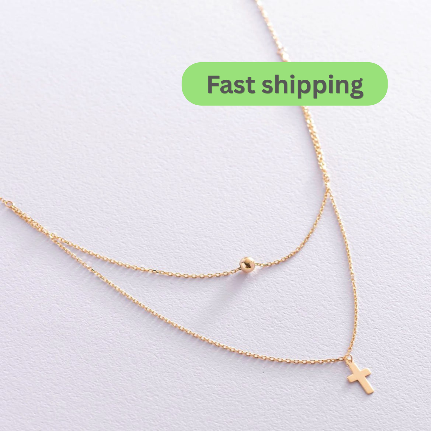 Gold necklace with a cross pendant 