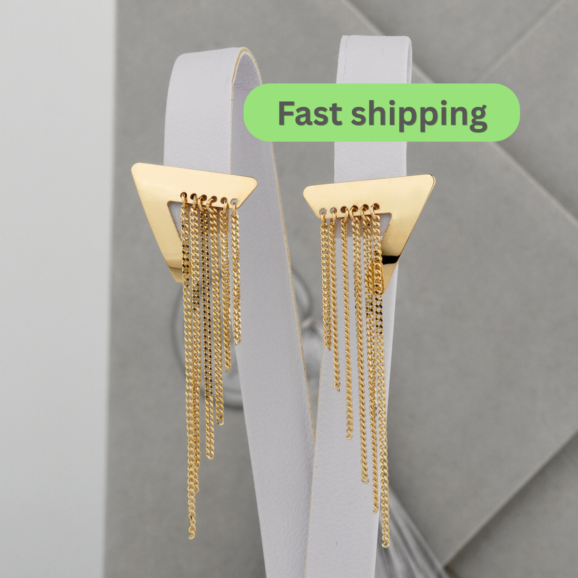 Gold triangle earrings with chain details 