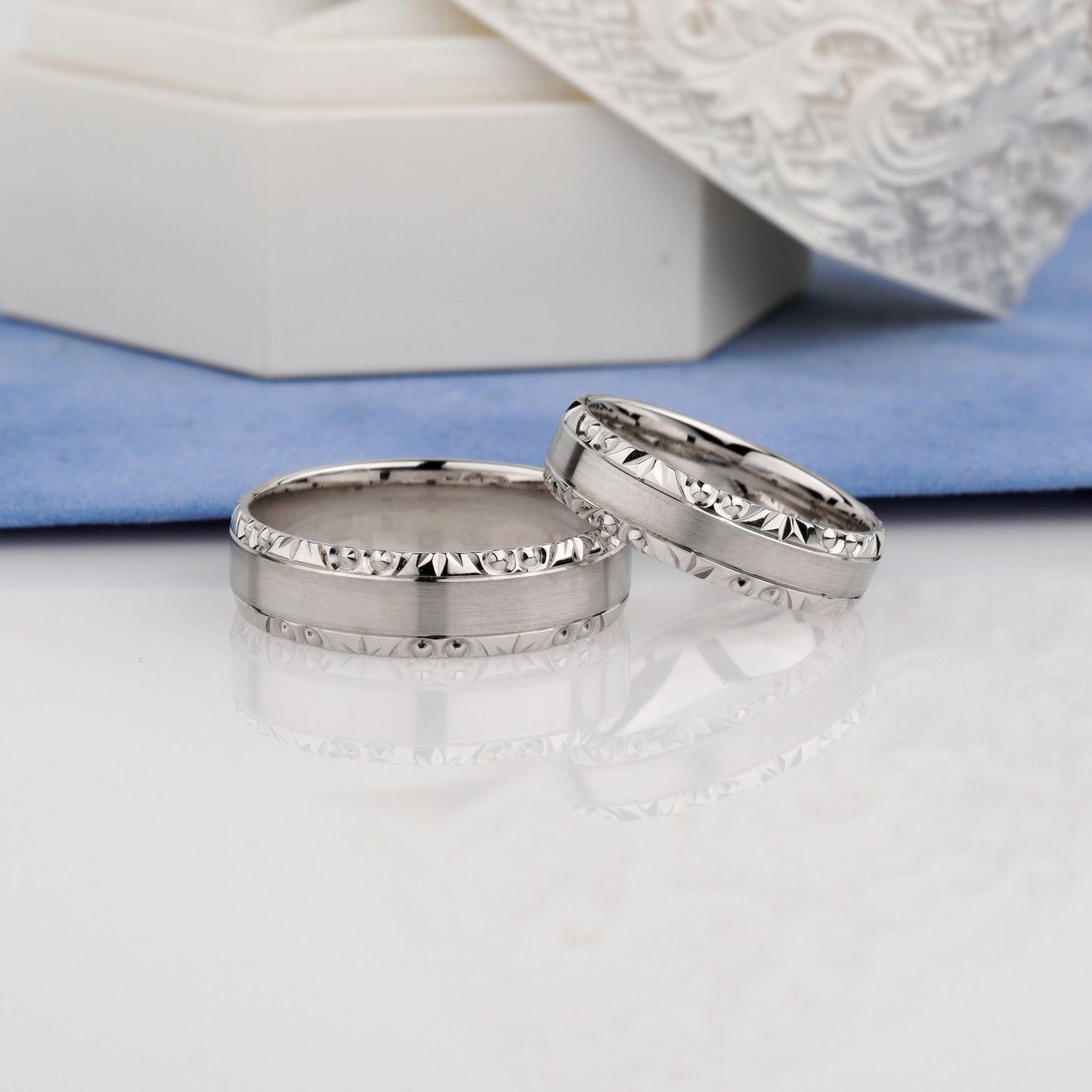 Two silver rings with diamond accents -wedding rings with bevel-bevelled edge wedding rings