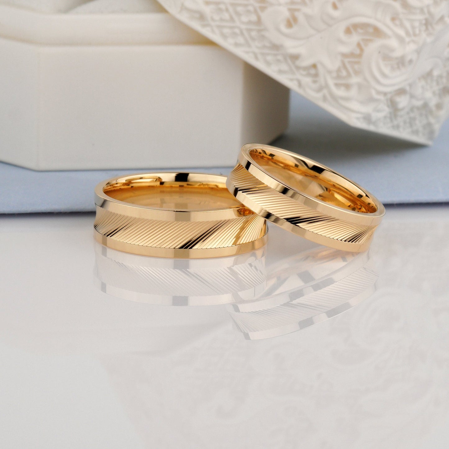 Two gold wedding rings -minimalist design, elegance and precise craftsmanship.