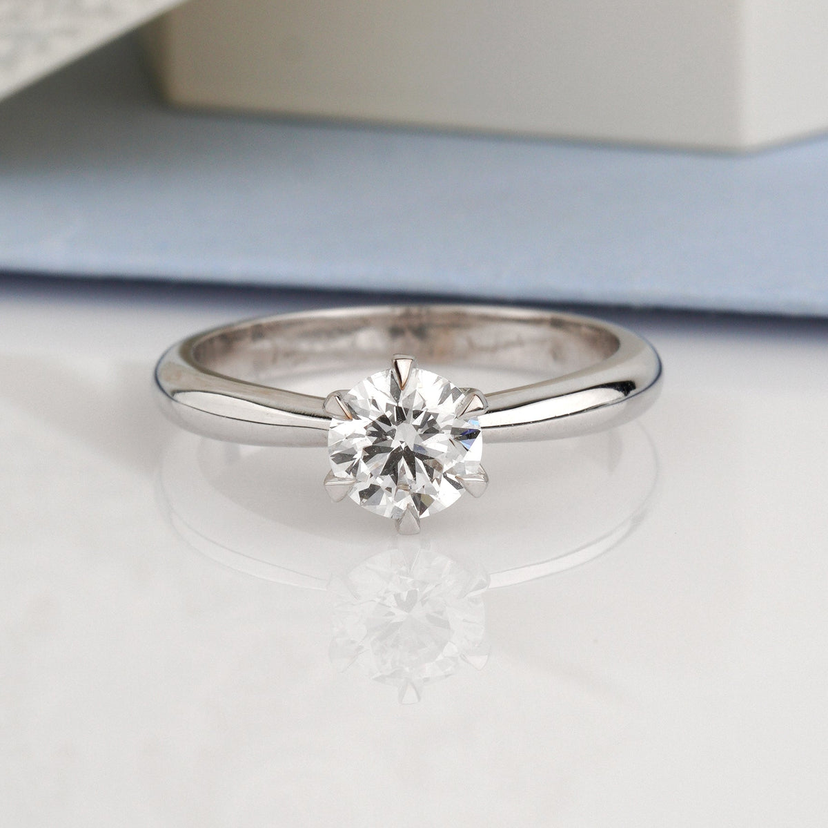 A classic solitaire engagement ring with a round brilliant-cut diamond set in a polished silver-colored band-Metal: 14k White Gold (585), solid-Center Stone: Lab-Grown Diamond, Round Cut, 0.7 ct VVS2/D, IGI Certified