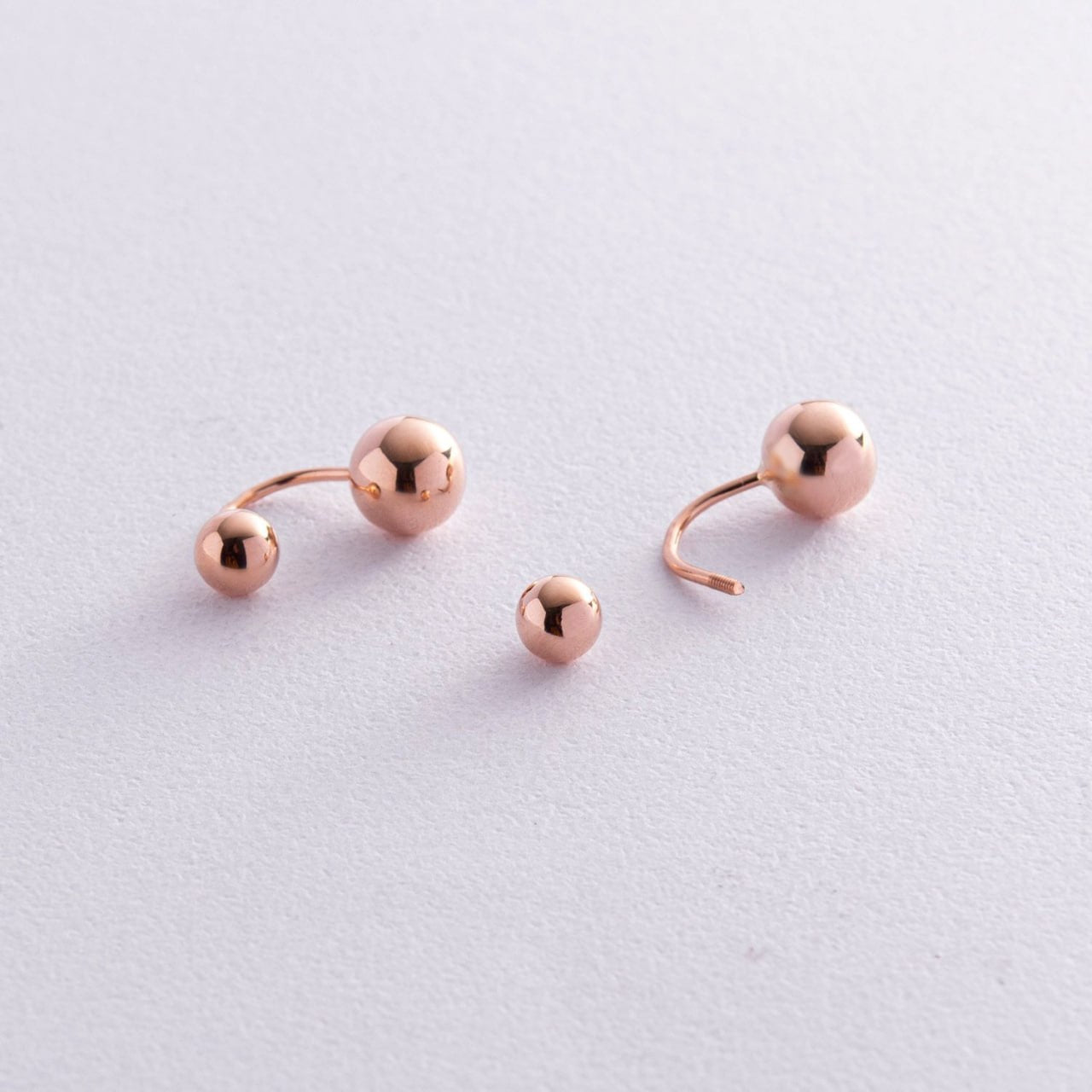 Three rose gold ball stud earrings-Earring size: 18 mm-Finish: High polish
