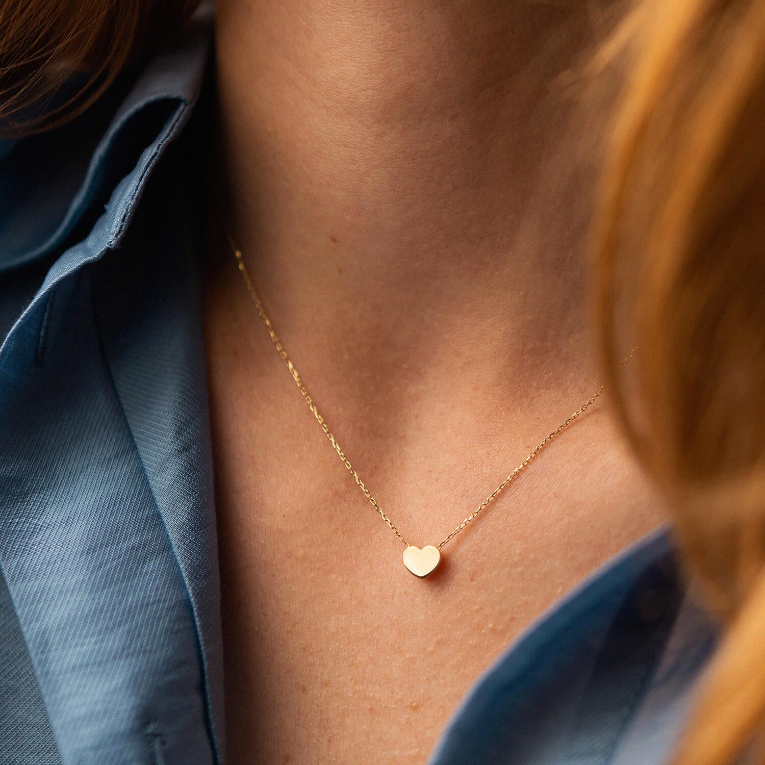 Gold heart necklace worn by a person -Delicate gold Necklace-Valentine’s Day gift-Tiny Heart Necklace