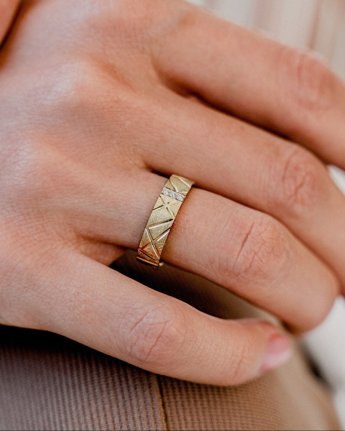 Gold ring on a finger-14k gold- 5 mm wide
