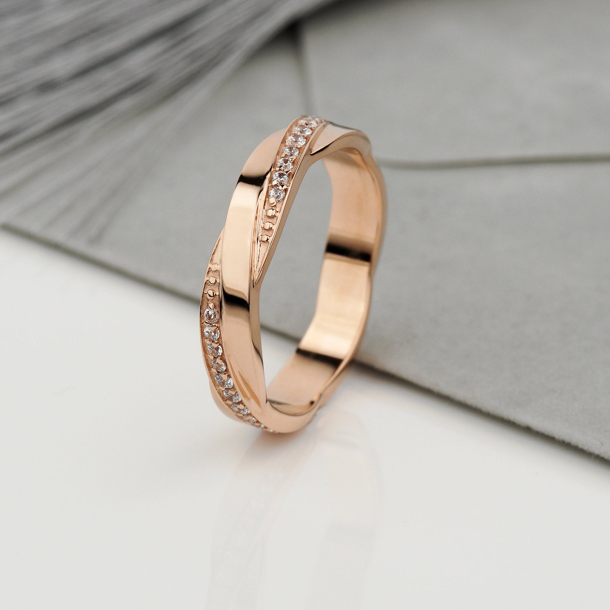 A rose gold band ring with a twisted design and a channel of small clear stones-rose gold wedding band -unique wedding ring -matte wedding band 
