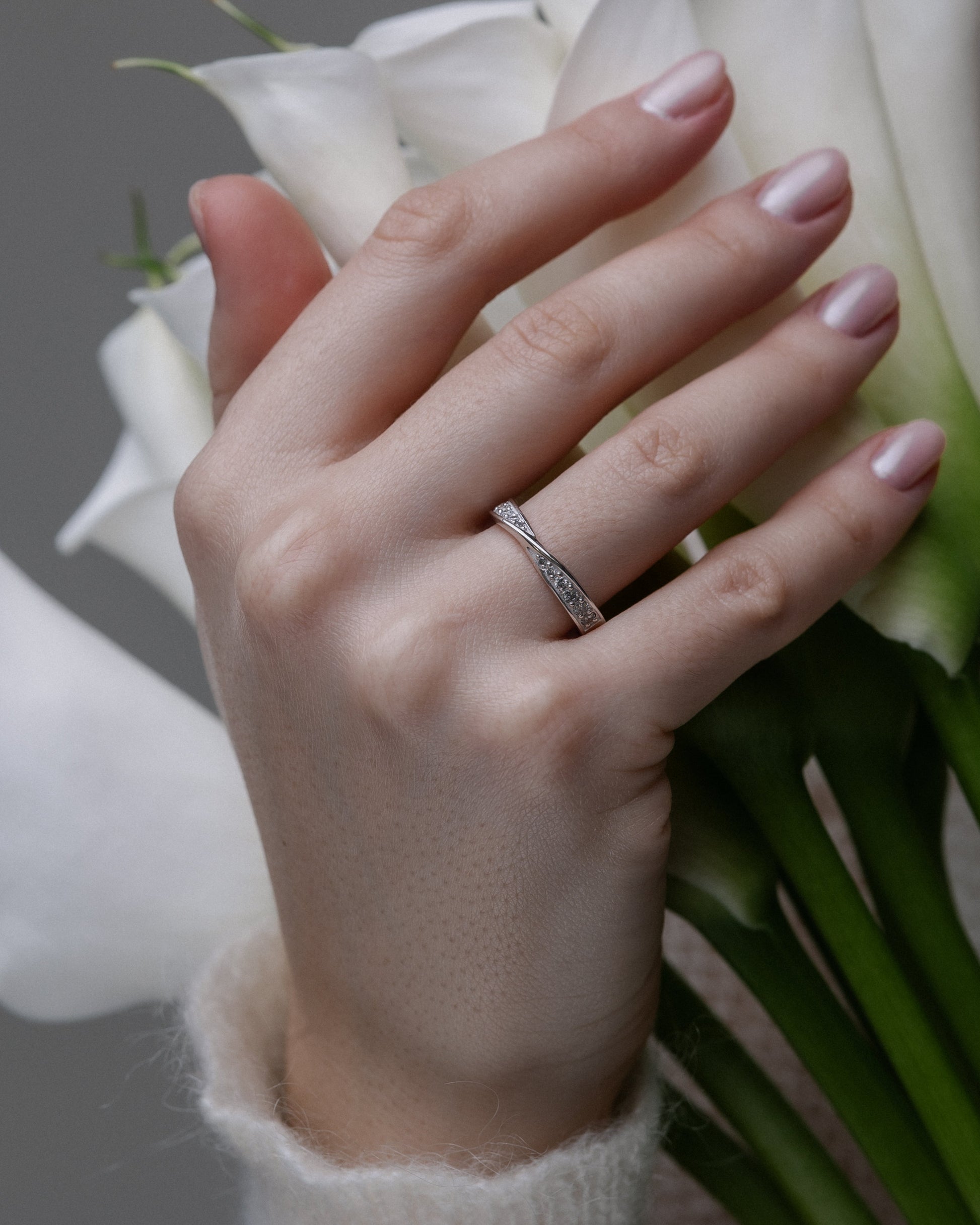 Hand with a ring -classic design with a unique, modern twist decorated with shinny diamonds.
