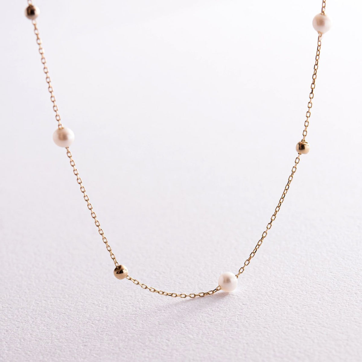 A delicate gold chain necklace featuring evenly spaced white pearl beads-gift for her-everyday gold necklace-simple pearl jewelry