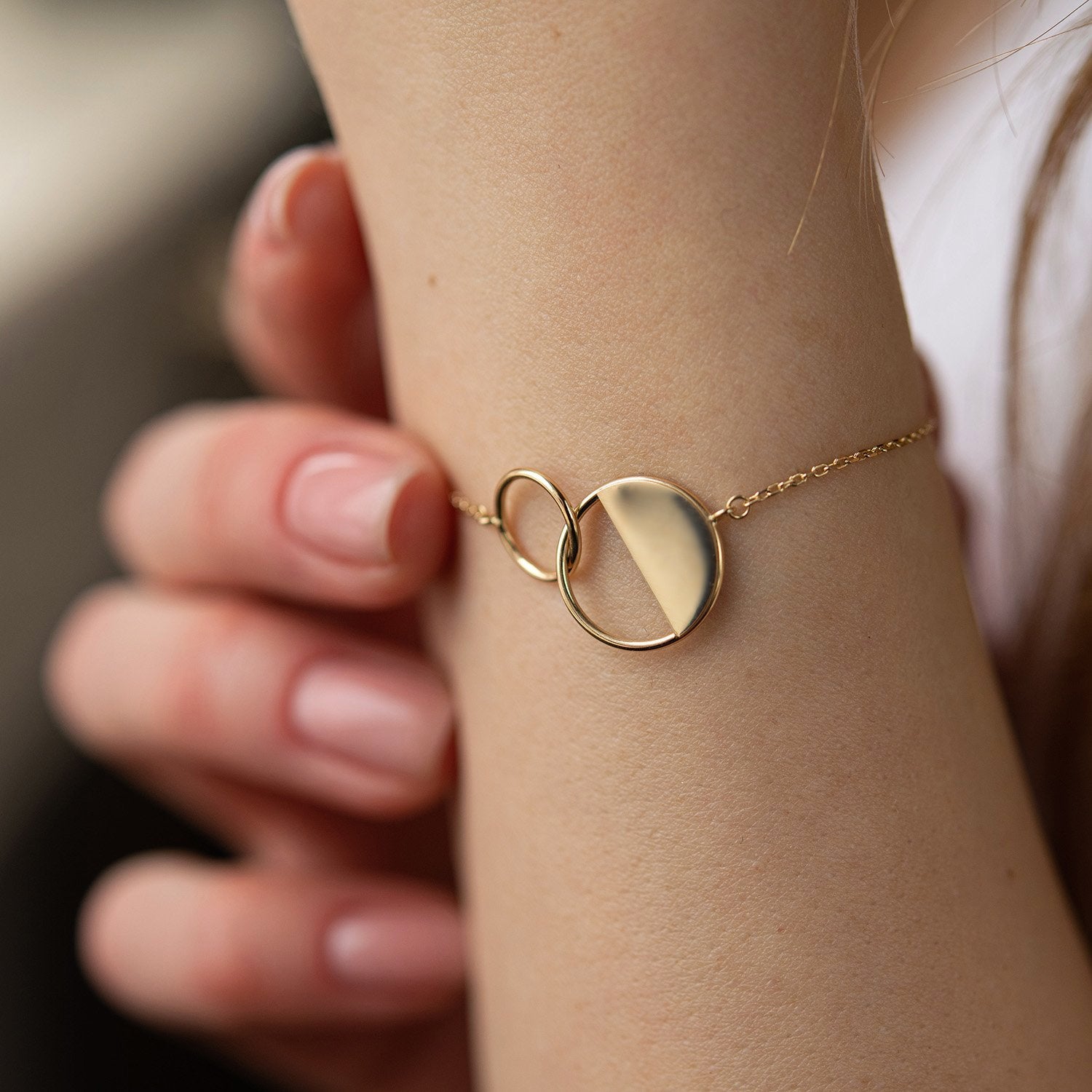 Gold bracelet on a wrist -everyday elegance-modern geometric charm