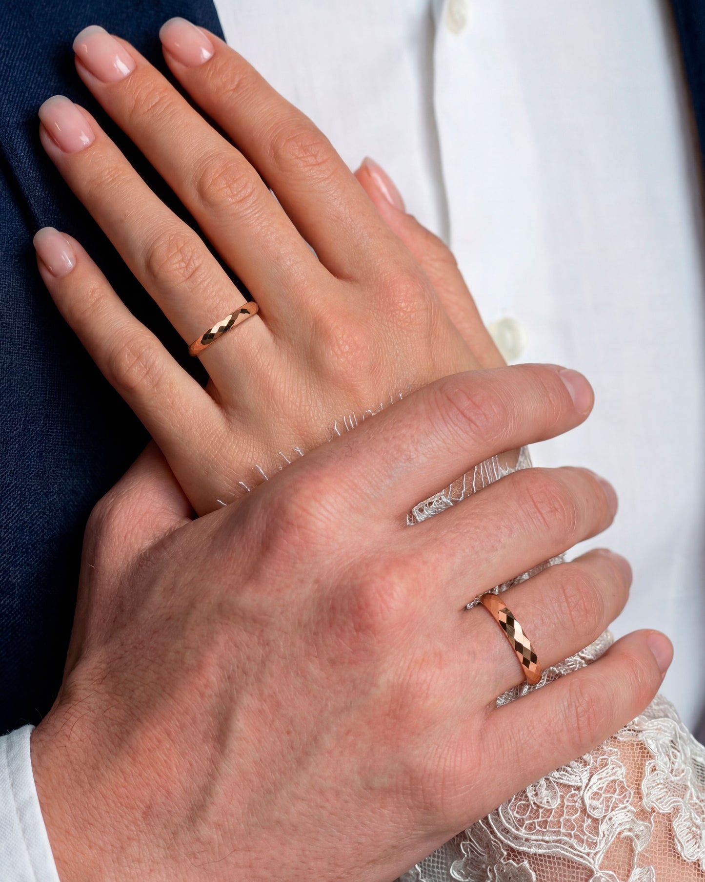 14K solid gold wedding bands- faceted texture- comfort fit interior on hands 