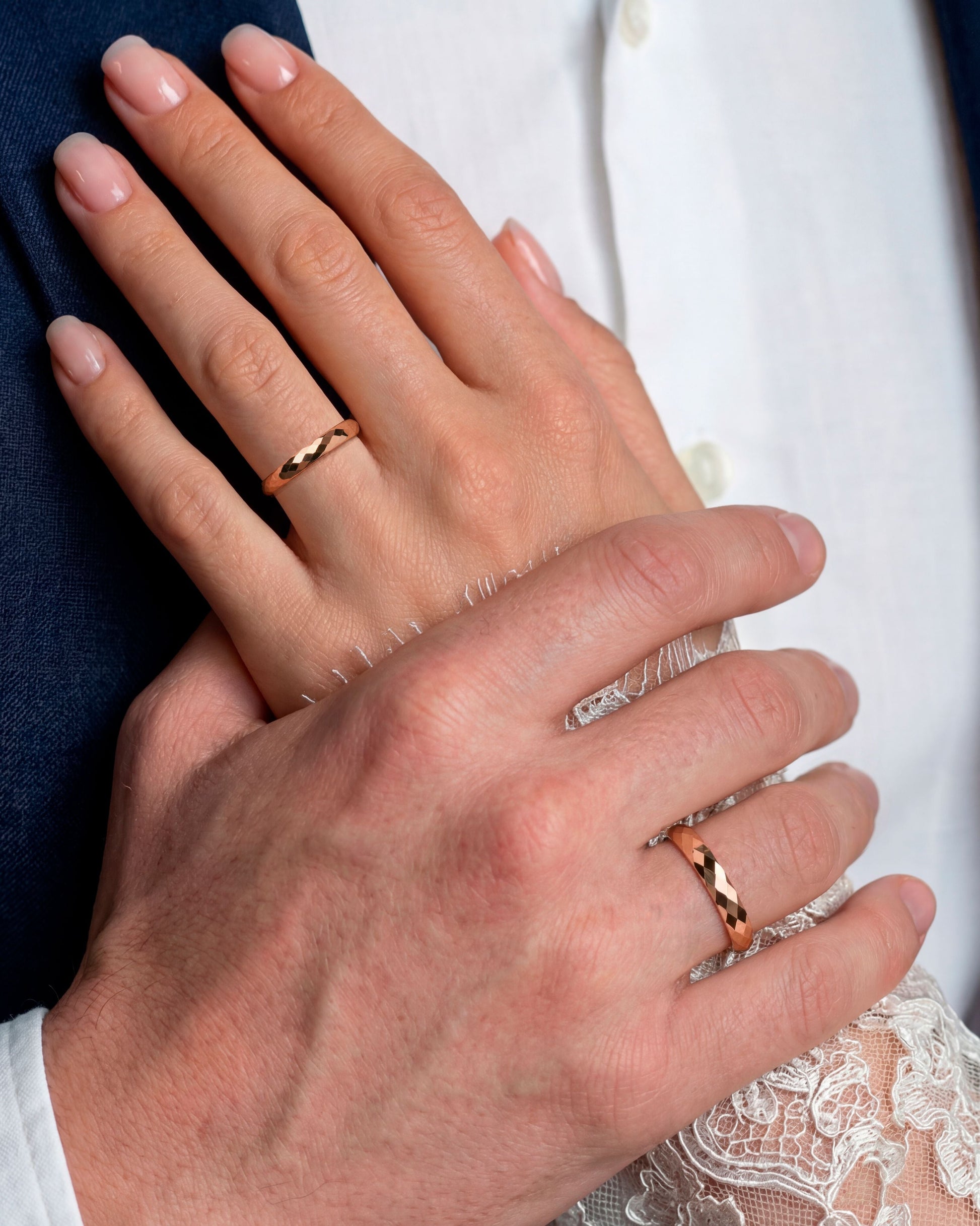 14K solid gold wedding bands- faceted texture- comfort fit interior on hands 