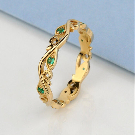 floral wedding band with emeralds 