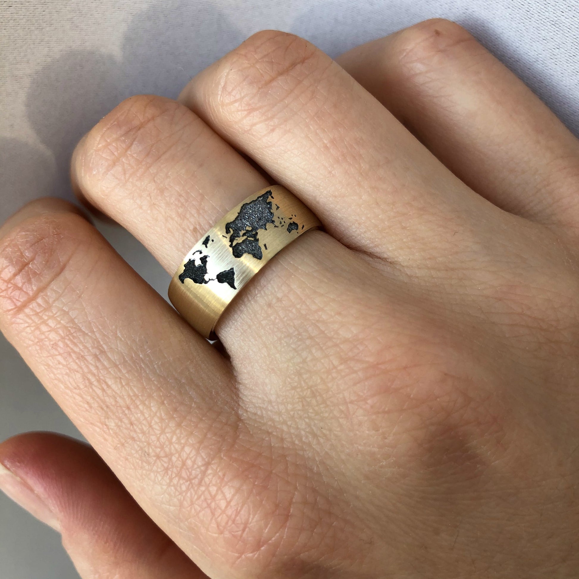 Gold ring with world map design - escorialjewelry