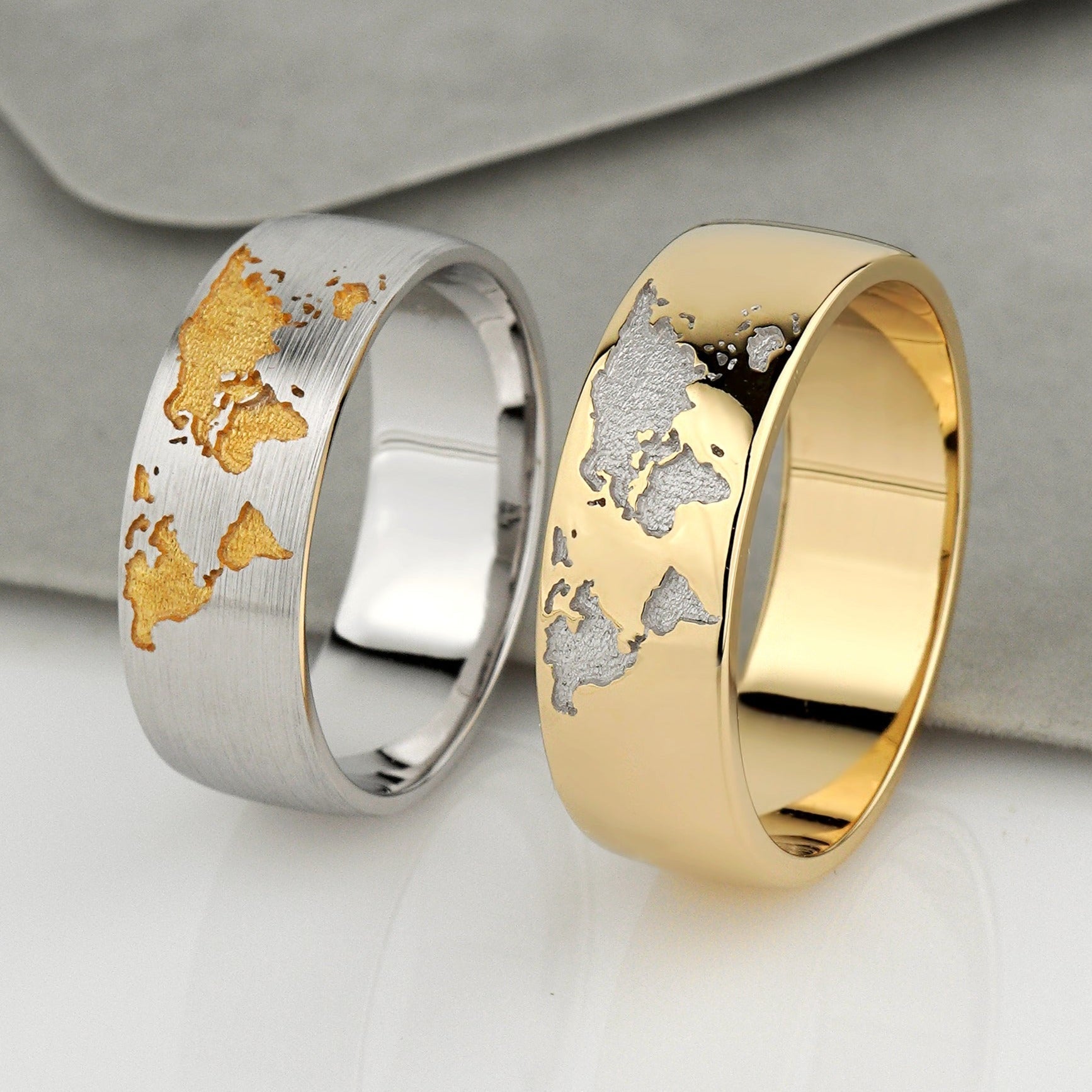 Gold wedding rings set with world map - escorialjewelry