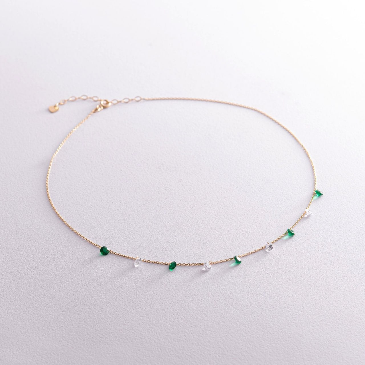 A delicate rose gold chain anklet featuring small green heart-shaped beads and clear faceted beads-dainty gold necklace-green stone necklace