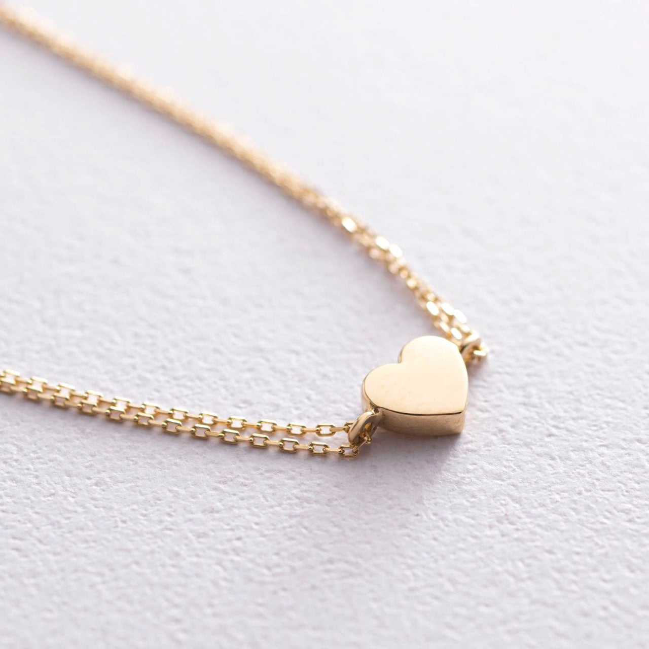 A delicate gold chain necklace featuring a small, polished gold heart pendant-gift for her-simple heart bracelet-everyday gold jewelry