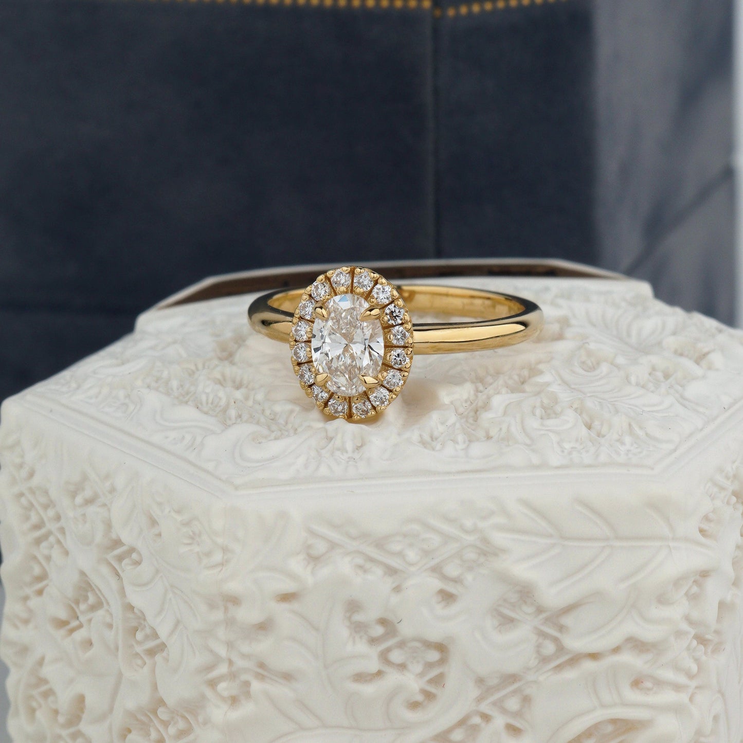  luminous oval diamond engagement ring wrapped in a soft halo of pavé diamonds- center stone: 0.5 ct oval lab diamond VVS2/D- total diamond weight: 0.66 ct