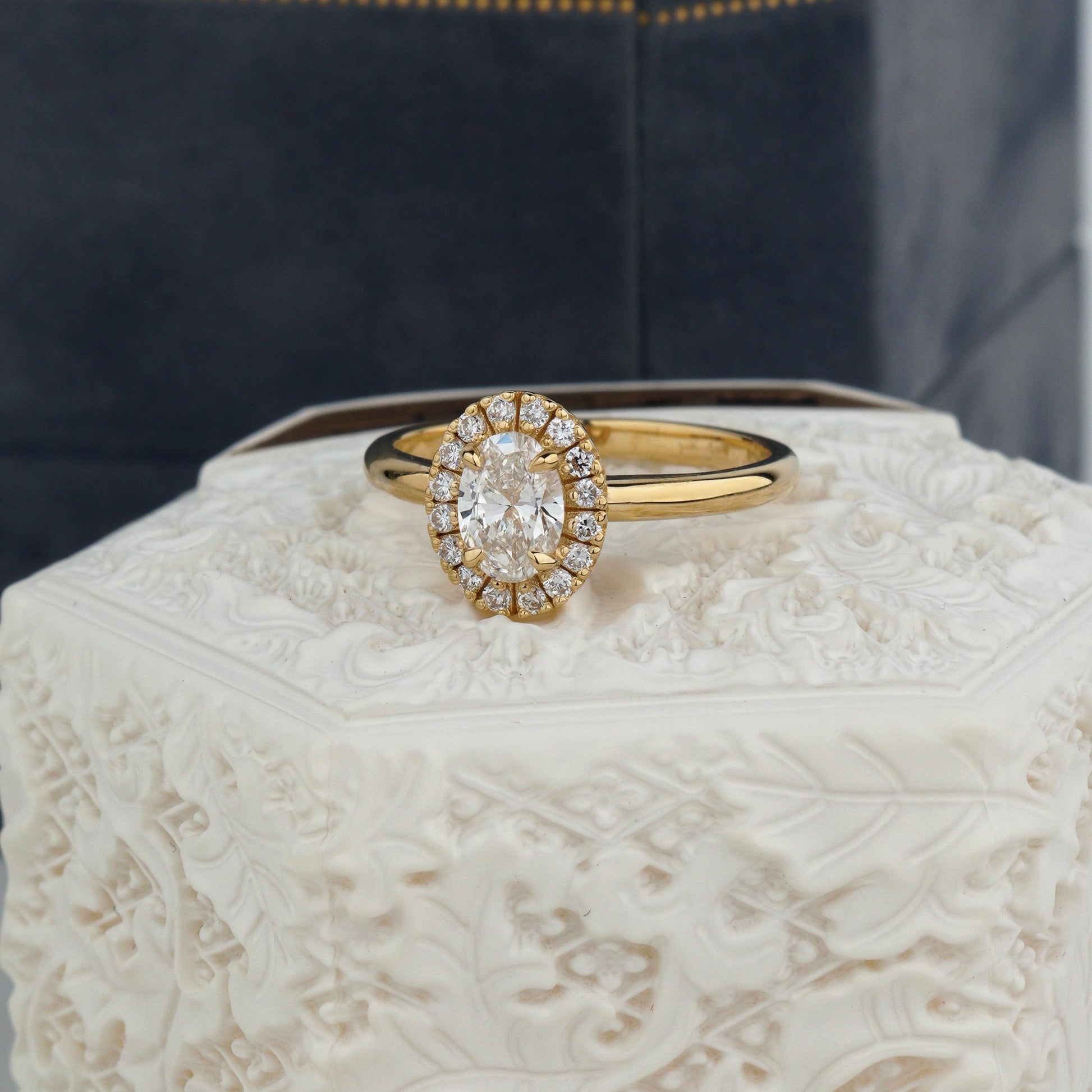  luminous oval diamond engagement ring wrapped in a soft halo of pavé diamonds- center stone: 0.5 ct oval lab diamond VVS2/D- total diamond weight: 0.66 ct