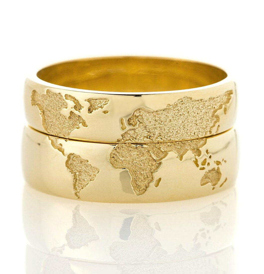 Gold wedding bands set with world map