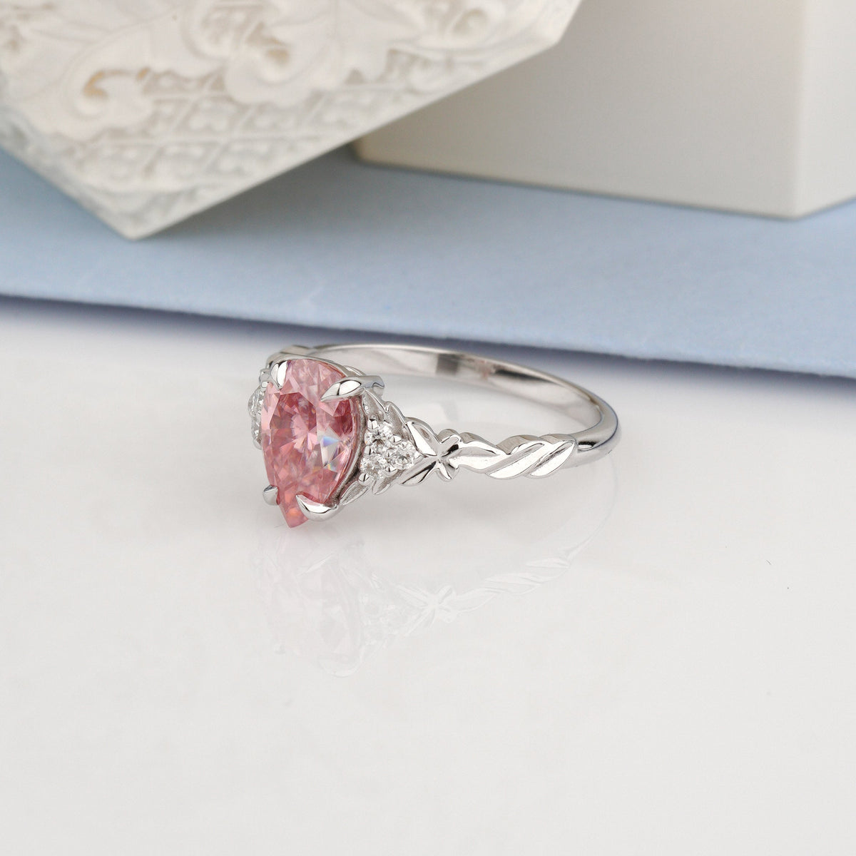 A white gold ring featuring a heart-shaped pink gemstone and small clear accent stones-vintage engagement ring-moissanite engagement ring-colored stone ring