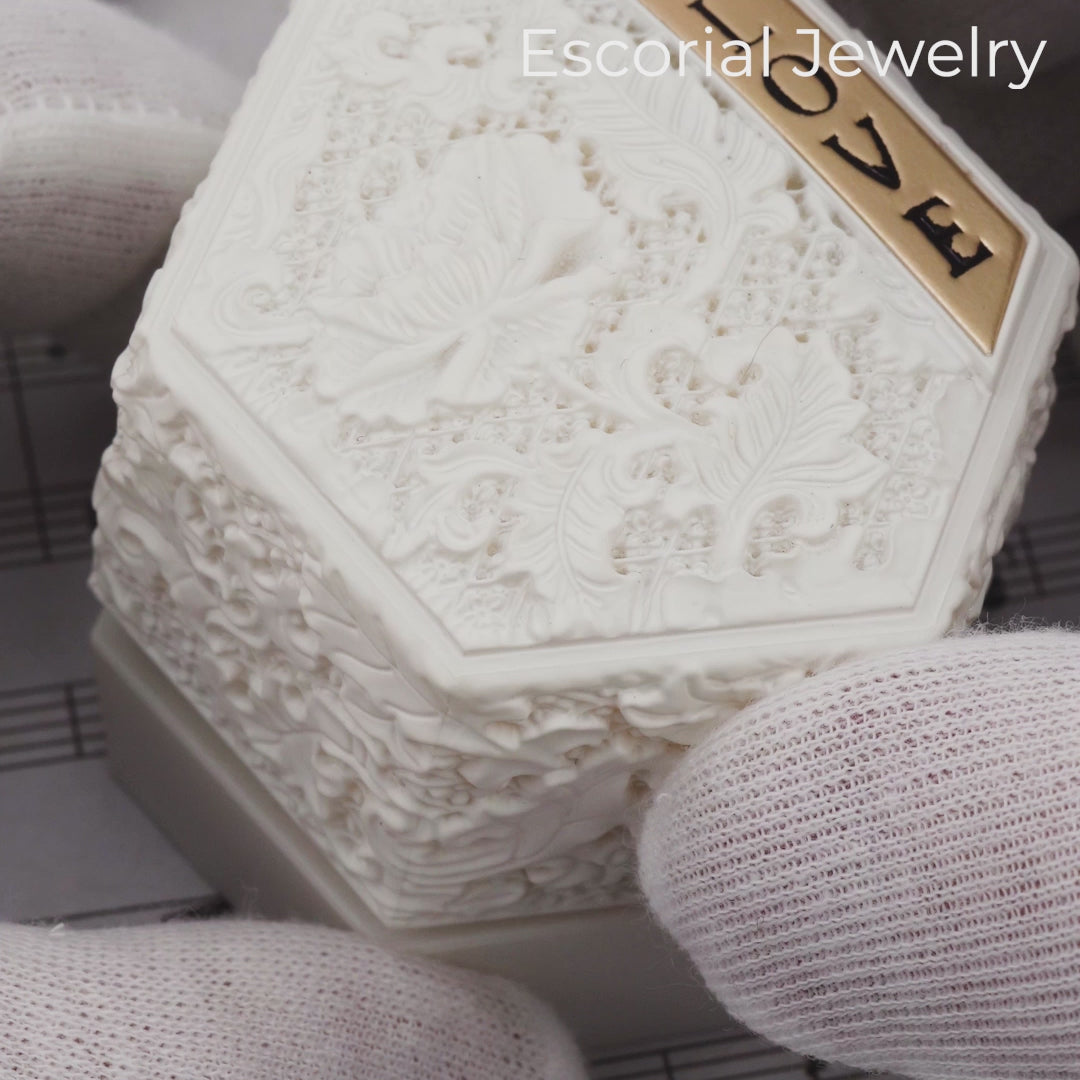 oval diamond engagement ring-total diamond weight: 0.66 ct-ring wrapped in a soft halo of pavé diamonds