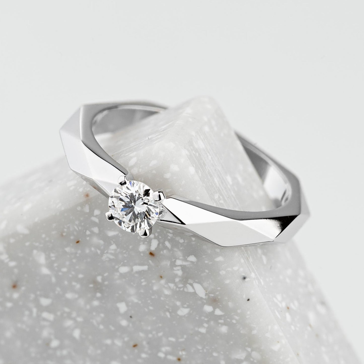Diamond engagement ring with unique faceted design. Solitaire Engagement Ring. White gold engagement ring. Natural diamond engagement ring. White gold diamond ring