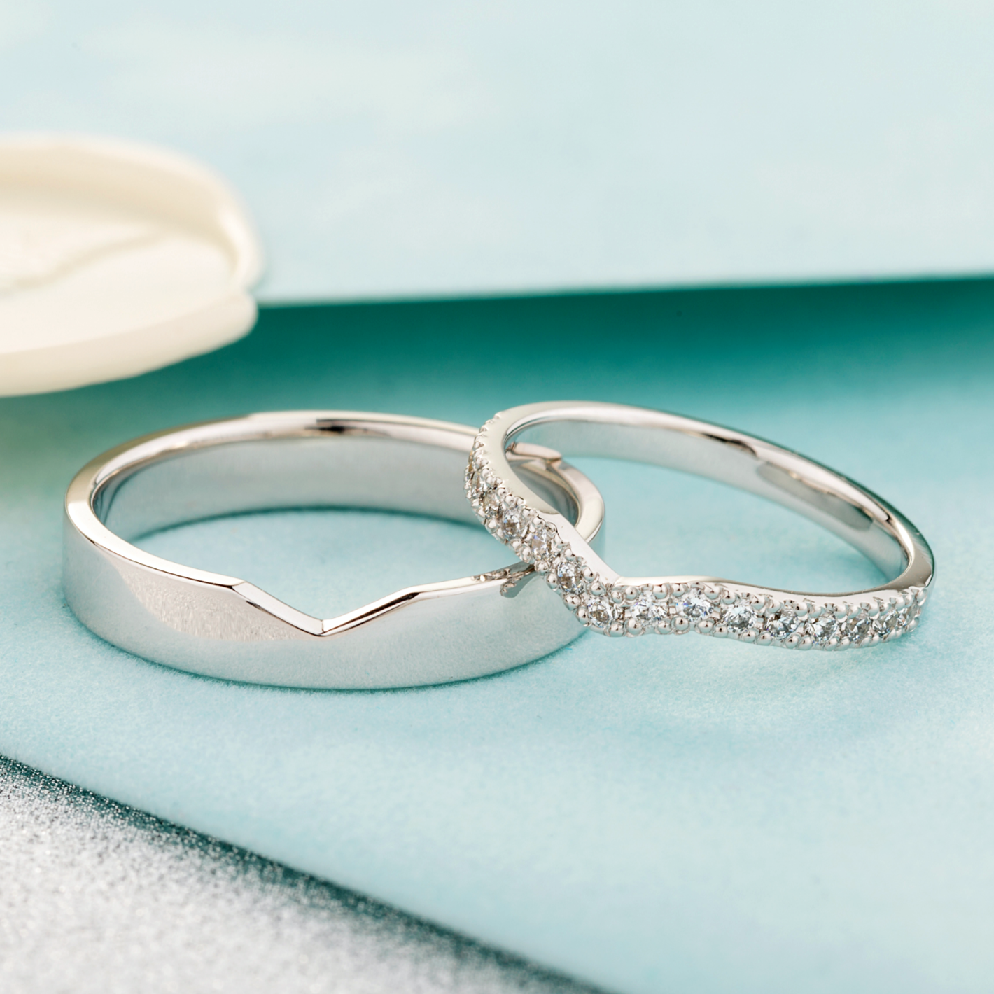 matching wedding bands with diamonds in her ring. Unique wedding bands. His and hers wedding rings set. White gold wedding bands. curved wedding rings. couple wedding rings